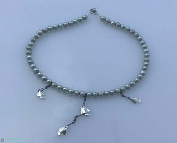RopeSea Pearl boats nautical jewelry necklace is made of unique color sea water grey green pearls attached to silver handmade boats.