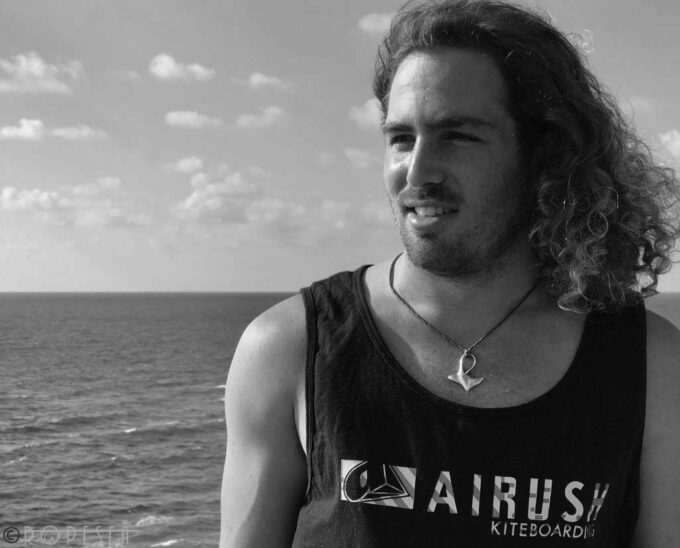 the Kite surfer Bar wolf wearing ropesea nautical jewelry big silver manta ray necklace in ocean view